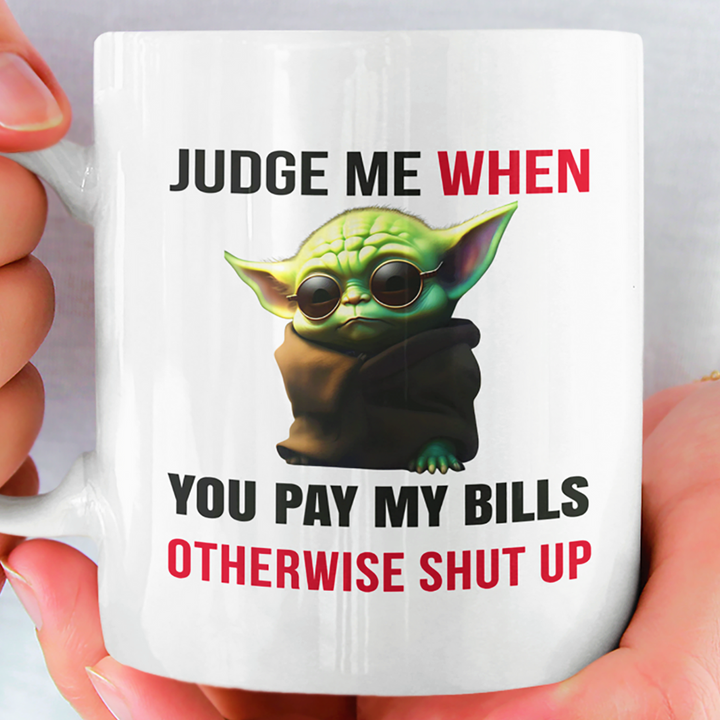 JUDGE ME WHEN YOU PAY MY BILLS MUG