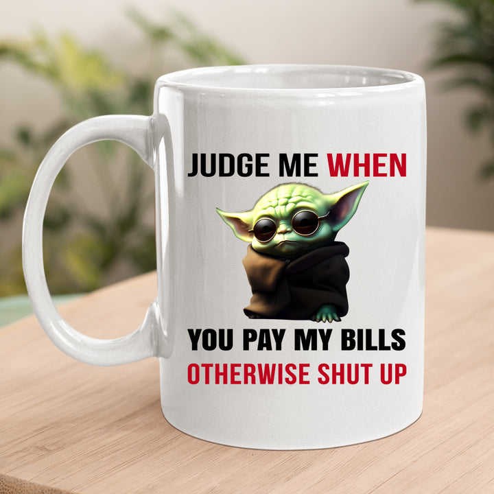 JUDGE ME WHEN YOU PAY MY BILLS MUG